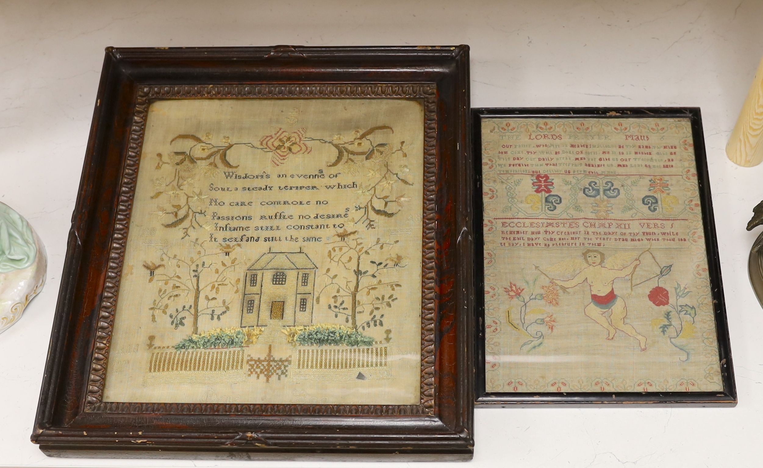 A George III finely embroidered Lords Prayer with angelic figure, flowers and text, 31 x 22cm, together with a later sampler, embroidered with house and trees, 35 x 29.5cm, both framed.
